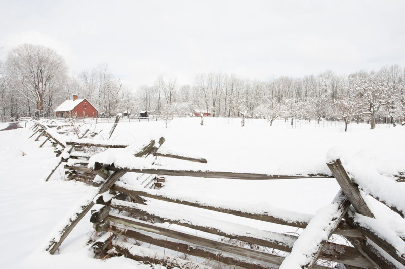 USA, New Jersey, Morristown, Field and fence covered with snow at Morristown National Historical Park