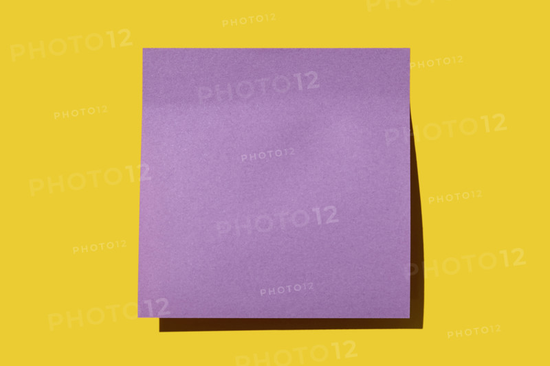 Blank purple post it note on yellow background