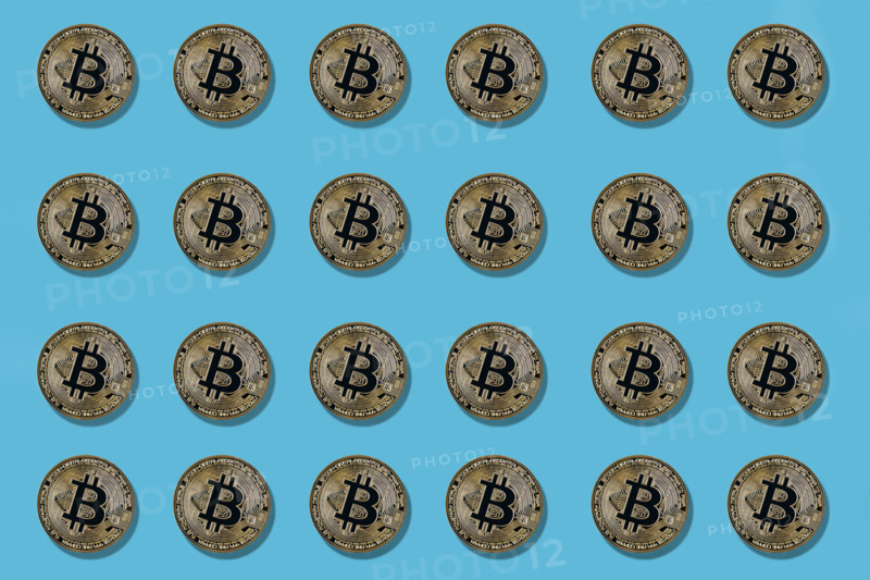Multiple bitcoin on blue background