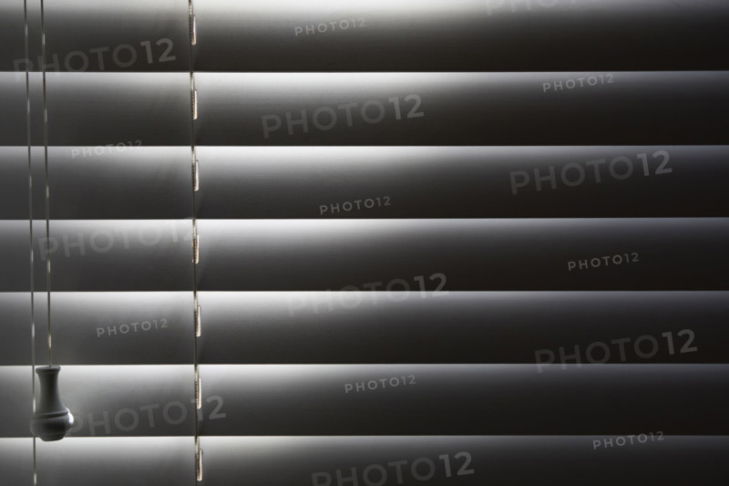 Close-up of window blinds with sunlight. New York City, New York State, USA.