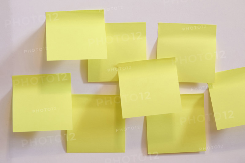 Blank yellow post it notes on wall. New York City, New York State, USA.