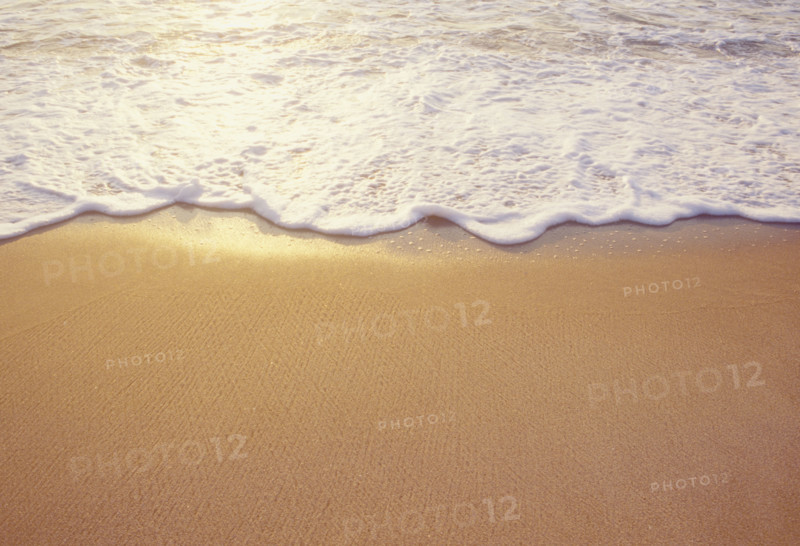 Close-up of sea wave washing sandy beach. Spring Lake, New Jersey, USA.