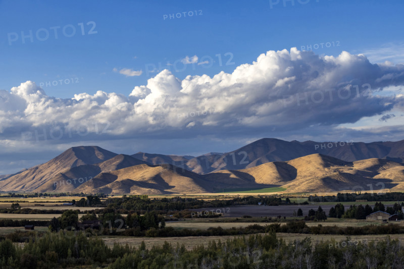 White puffy clouds over mountains. Bellevue, Idaho, USA.