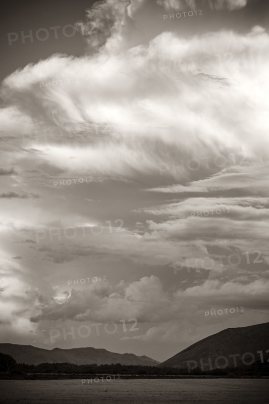 Dramatic clouds over mountains, black and white. Bellevue, Idaho, USA.