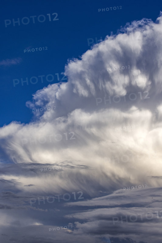 Dramatic white clouds in sunlight on blue sky. Bellevue, Idaho, USA.