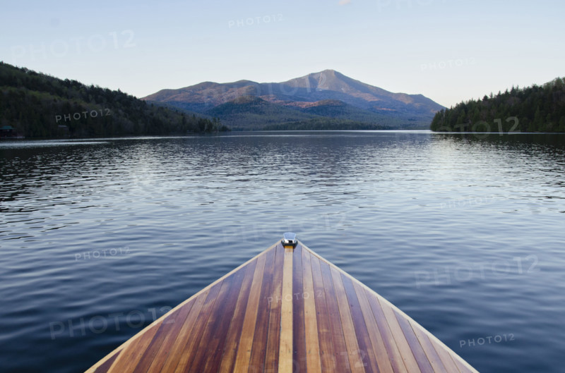 Bow of wooden boat on Lake Placid. Lake Placid, New York State, USA.