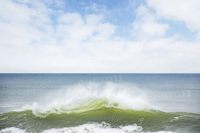 Ocean wave splashing on shore. Nantucket, Massachusetts, USA.
