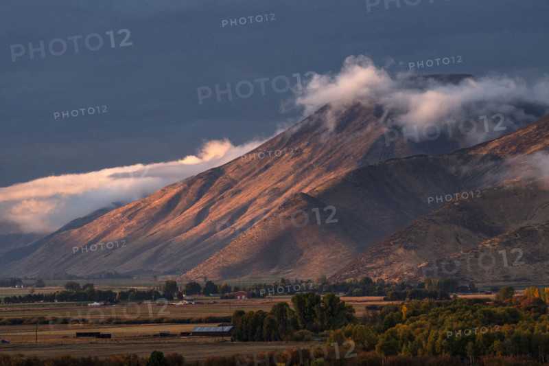 Clouds covering hills in late afternoon light. Bellevue, Idaho, USA.