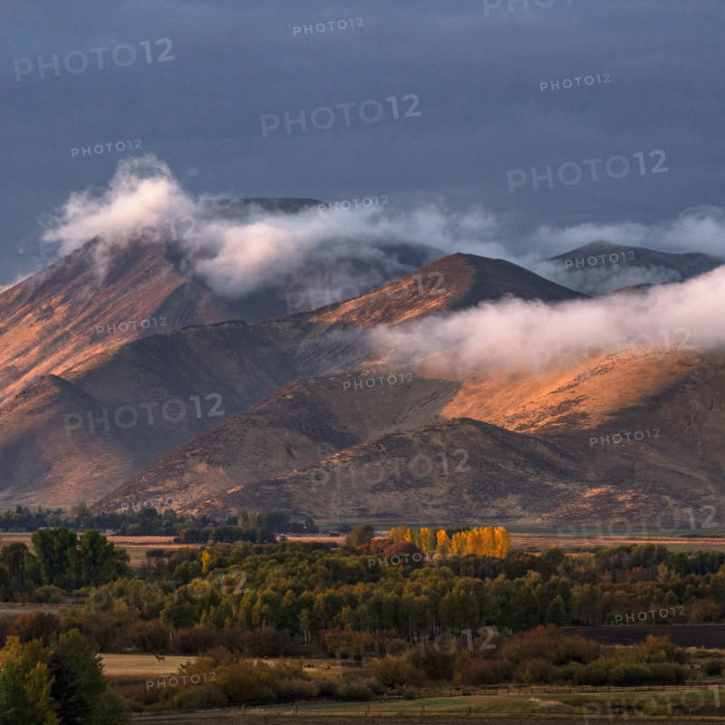 Clouds covering hills in late afternoon light. Bellevue, Idaho, USA.