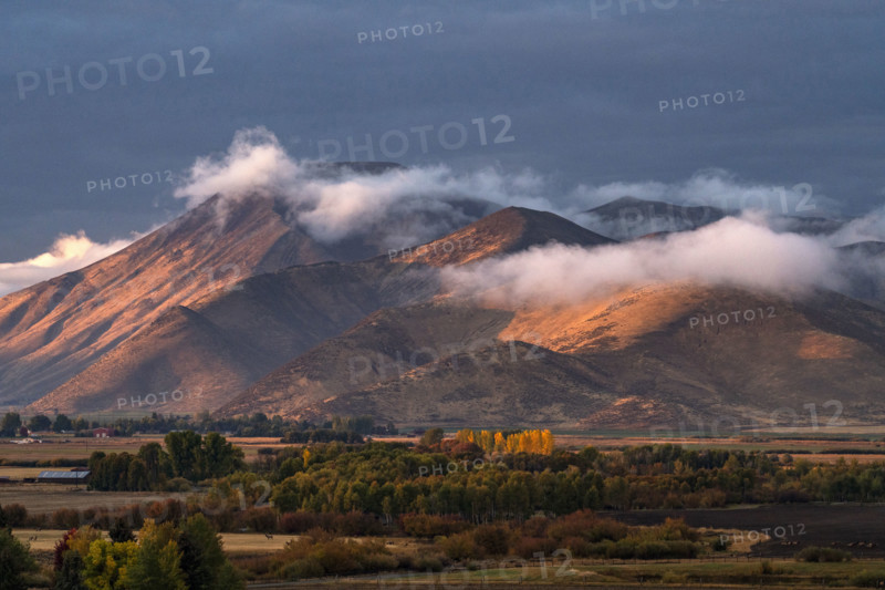 Clouds covering hills in late afternoon light. Bellevue, Idaho, USA.