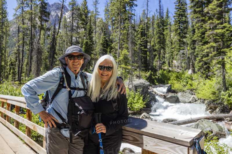 Portrait of senior hikes in Sawtooth Mountains by Redfish Creek. Stanley, Idaho, USA.