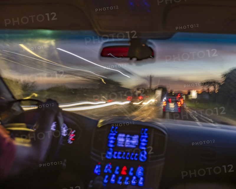 Passenger view of dusk traffic from car, blurred motion. , Guanacaste, Costa Rica.