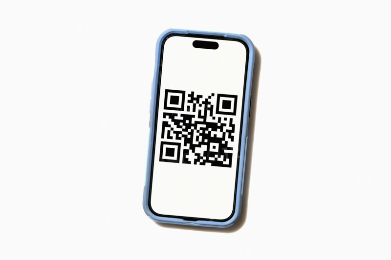 Studio shot of smart phone displaying QR code. New York City, New York State, USA.