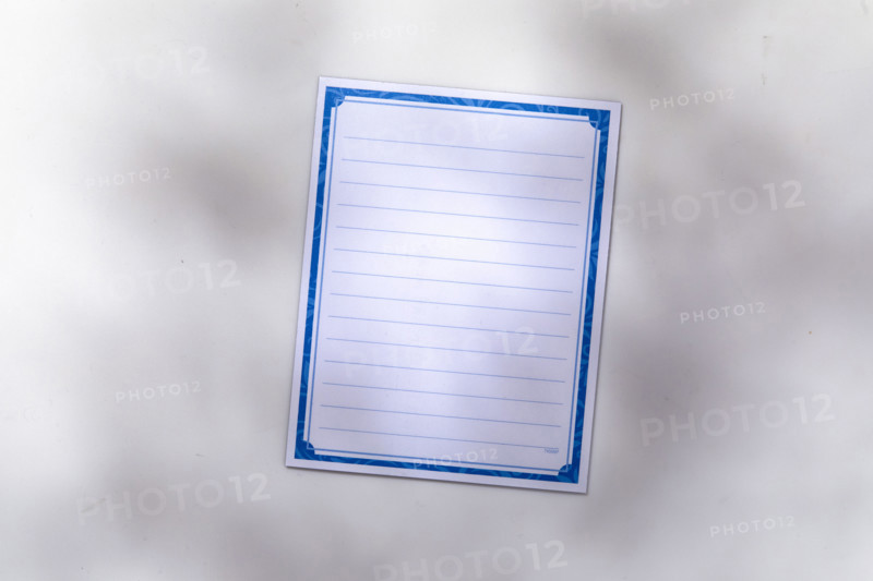 Blank lined notepad on white background. New York City, New York State, USA.
