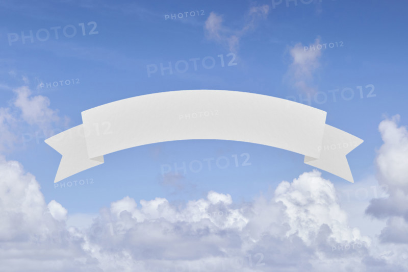 Blank banner in front of blue sky and white clouds. New York City, New York State, USA.