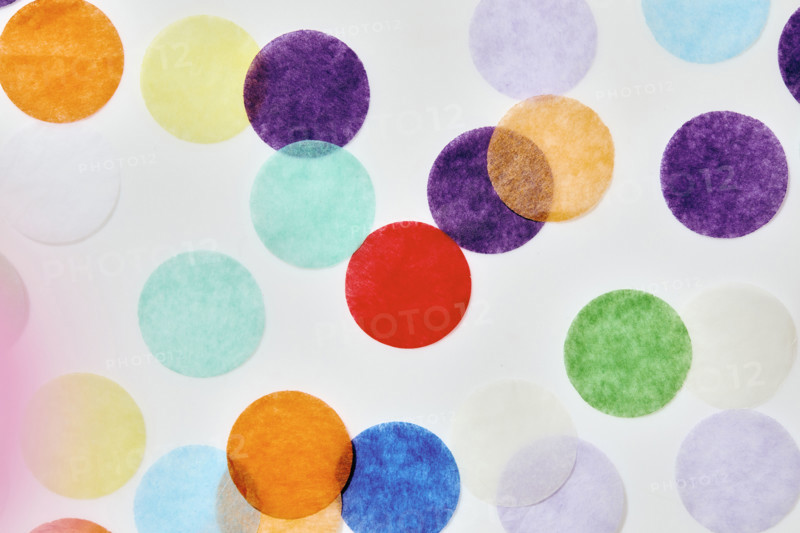 Close-up of colorful confetti on white background. New York City, New York State, USA.
