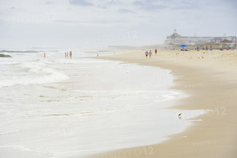 Waves washing beach on cloudy day. Spring Lake, New Jersey, USA.