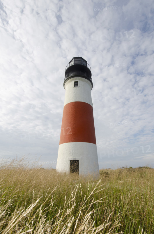 Sankaty Head Lighthouse against cloudy sky, Nantucket, Massachusetts, USA.