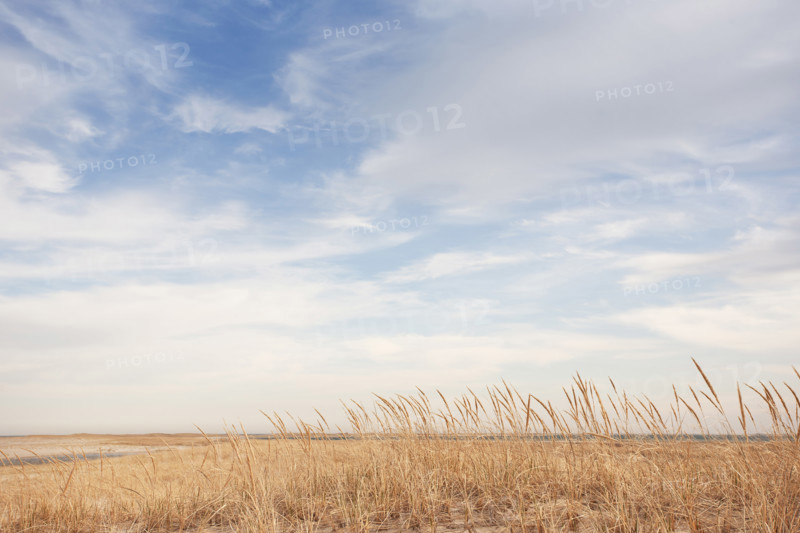 White clouds above empty Lighthouse Beach, Chatham, Massachusetts, USA.