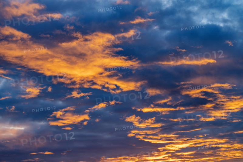 Golden clouds against sky at sunrise, Kettleman City, California, USA.