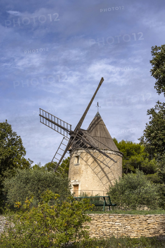Antique windmill in rural landscape, Gordes, Vaucluse, France.