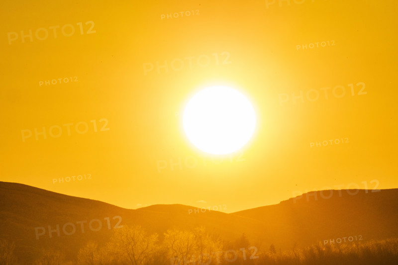 Sun setting over hills, Bellevue, Idaho, USA.
