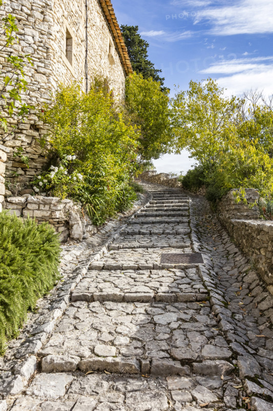 Empty stone path in old village, Gordes, Vaucluse, France.