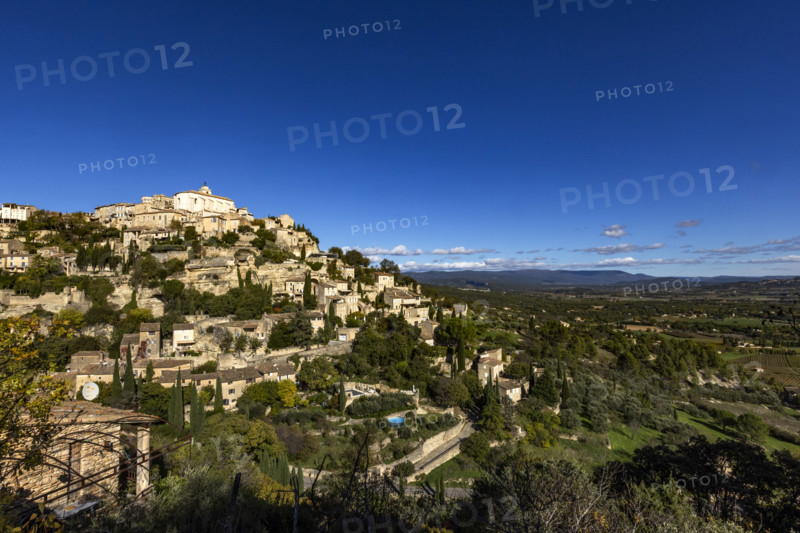 Old town on hill on sunny day, Gordes, Vaucluse, France.
