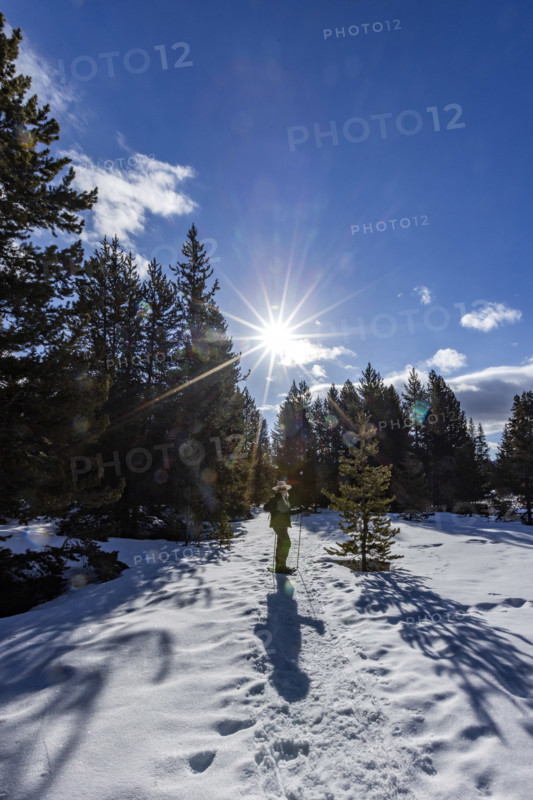 Senior woman snowshoeing in Sun Valley, Sun Valley, Idaho, USA.