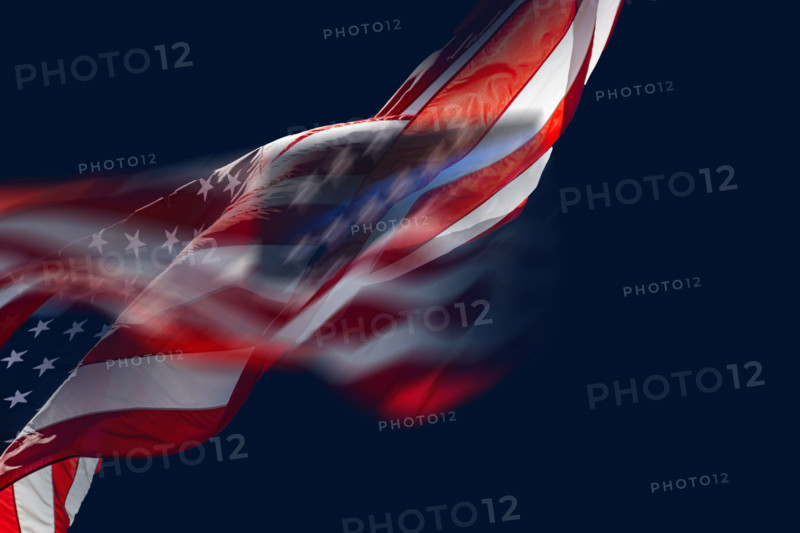 American flag waving against dark blue sky, Boca Raton, Florida, USA.