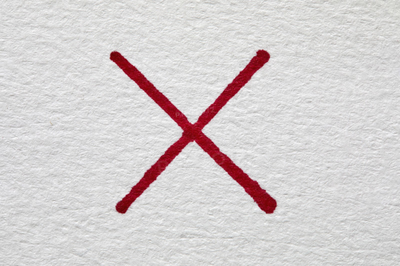 Red letter X on white background, New York City, New York, USA.