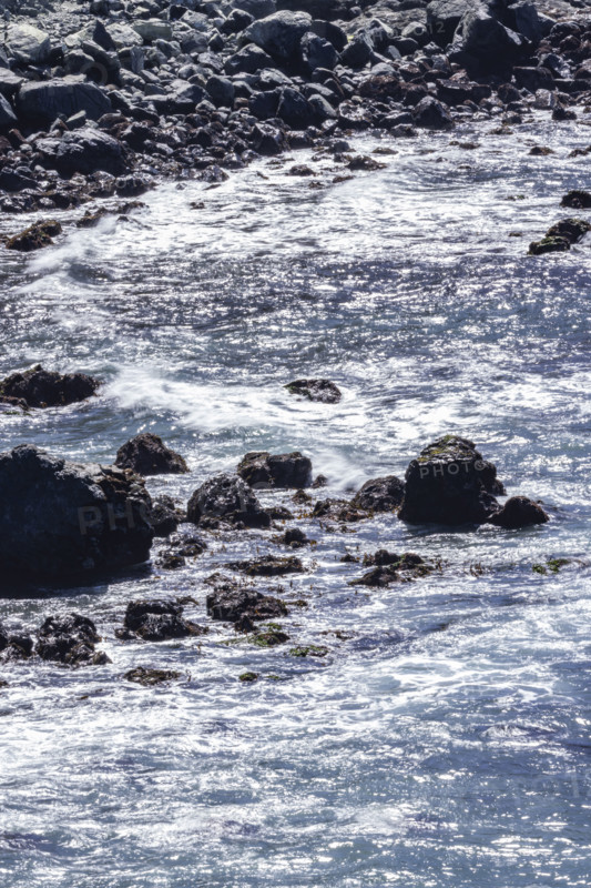 Ocean waves washing rocky coast