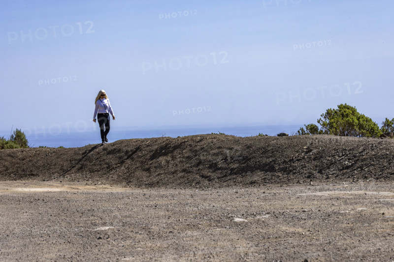Woman walking along the Big Sur Coast