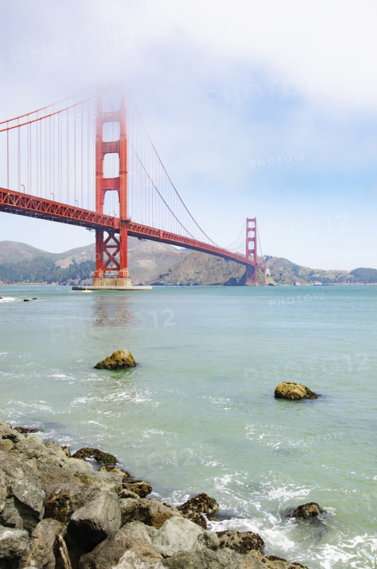 Morning fog lifting over Golden Gate Bridge
