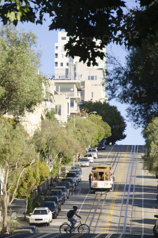 Tram on downtown street on summer afternoon