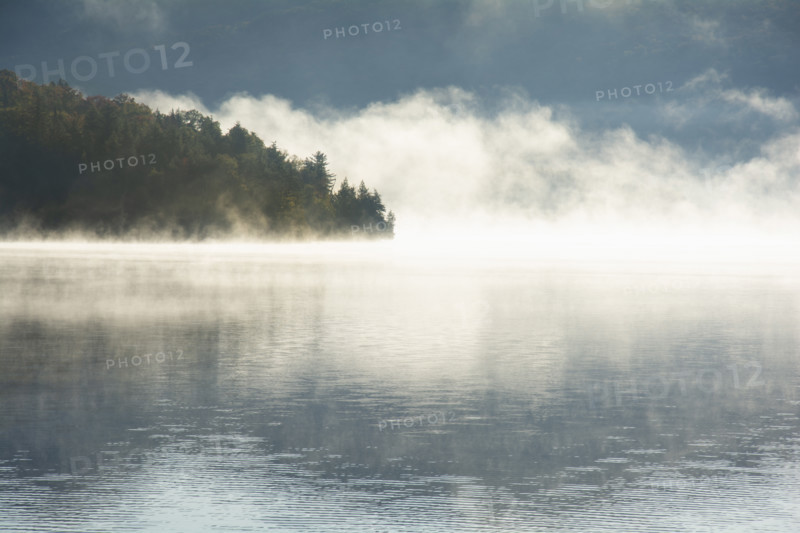 Morning mist on calm Lake Placid