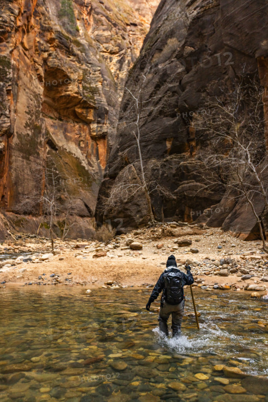 Rear view of woman wading The Narrows of Virgin River