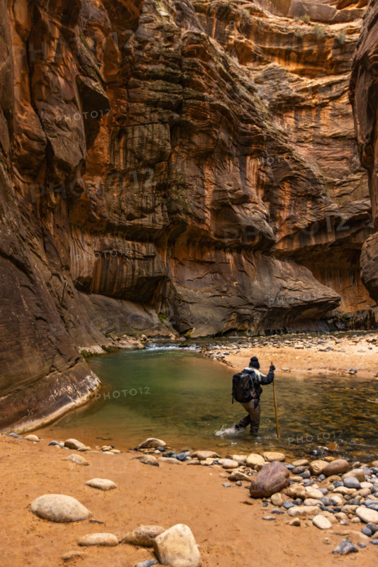 Woman wading The Narrows of Virgin River