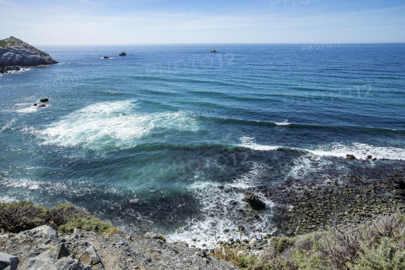 Calm ocean waves washing Big Sur coast
