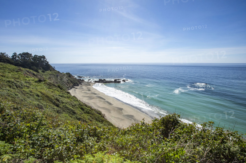 Calm ocean waves washing Big Sur coast