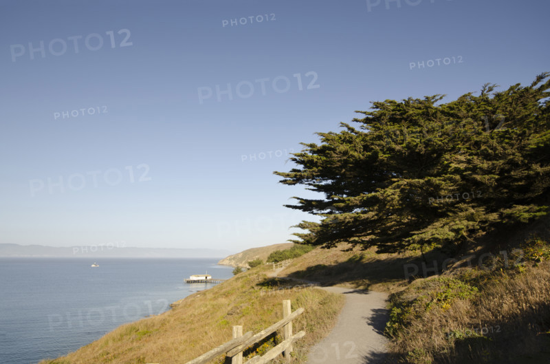 Walking path by Drakes Bay on sunny day