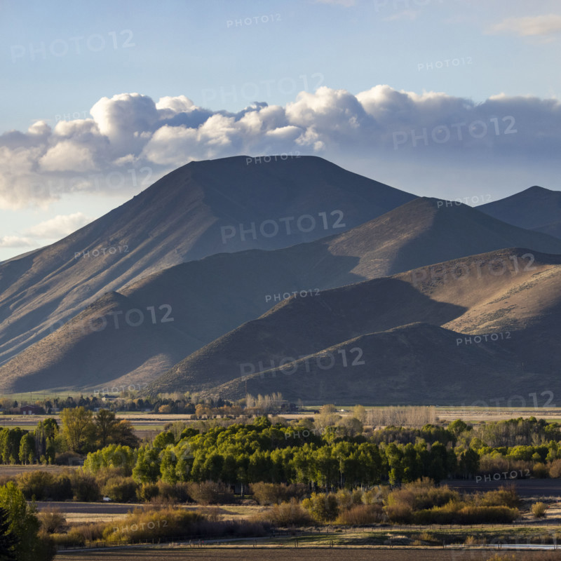 Clouds over barren Bell Mountain