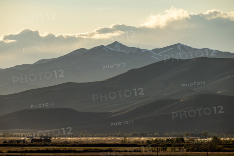 Clouds above mountains at sunset