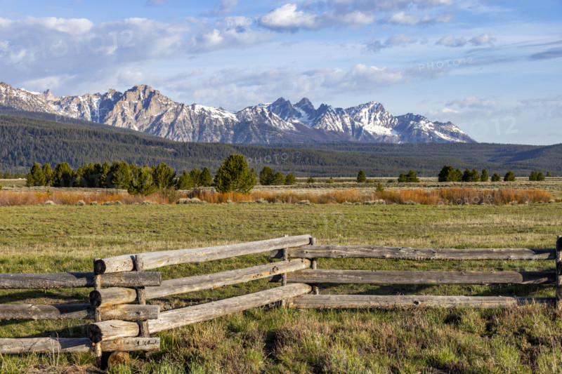 Rustic wooden fence with Sawtooth Mountains in background