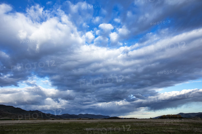 Dramatic skies over rural landscape