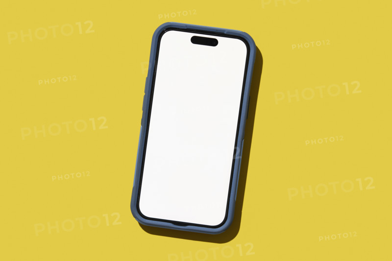 Blank smart phone on yellow background