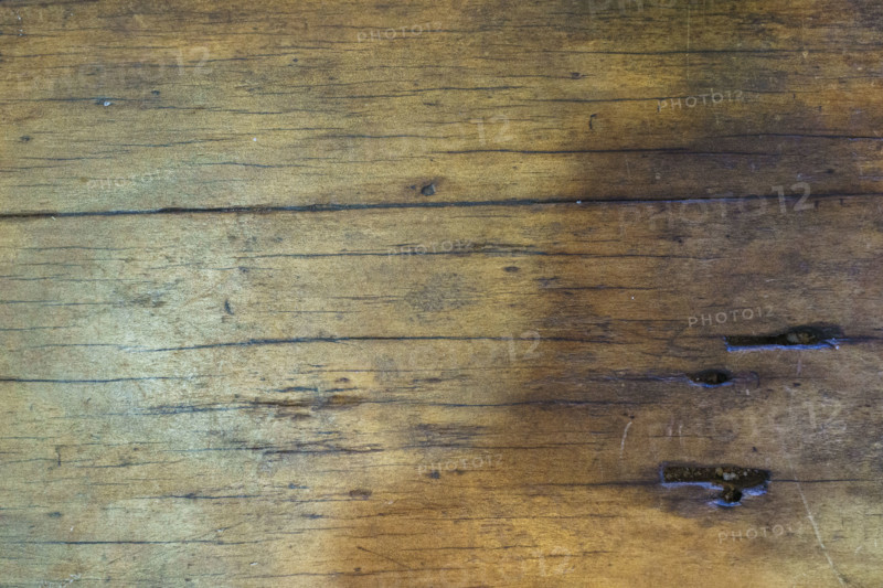 Close-up of scarred old wooden tabletop