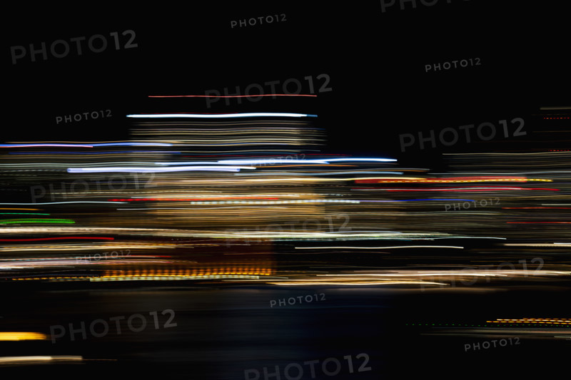 Horizontal light trails on dark background