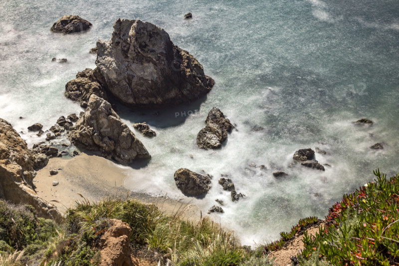 Water swirling around rocks, motion blur