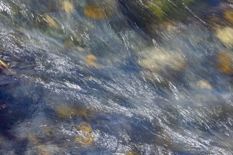 Close-up of pristine mountain creek water, motion blur